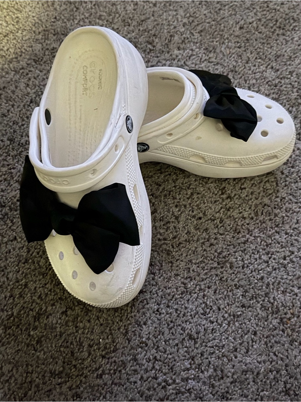 CROCS White Clog Mules with Black Bow Accent